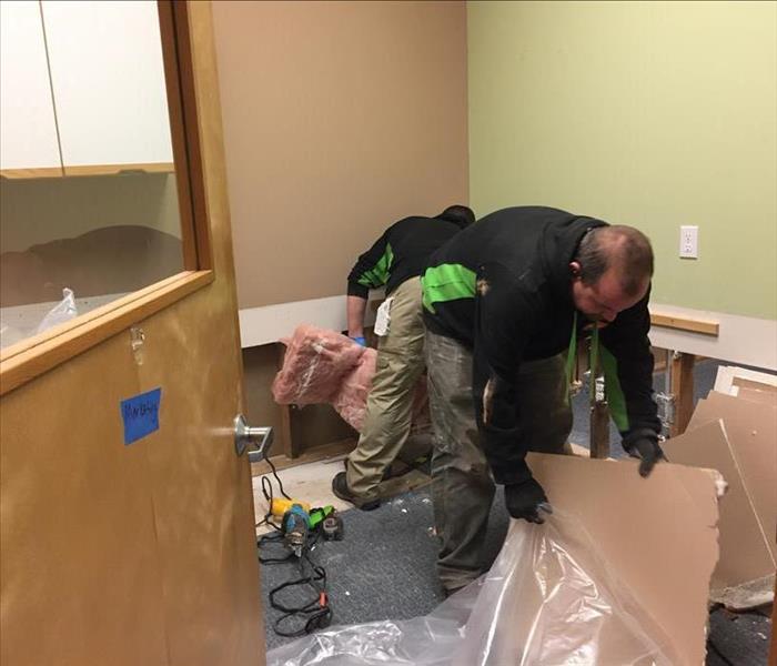 SERVPRO technicians removing damaged drywall